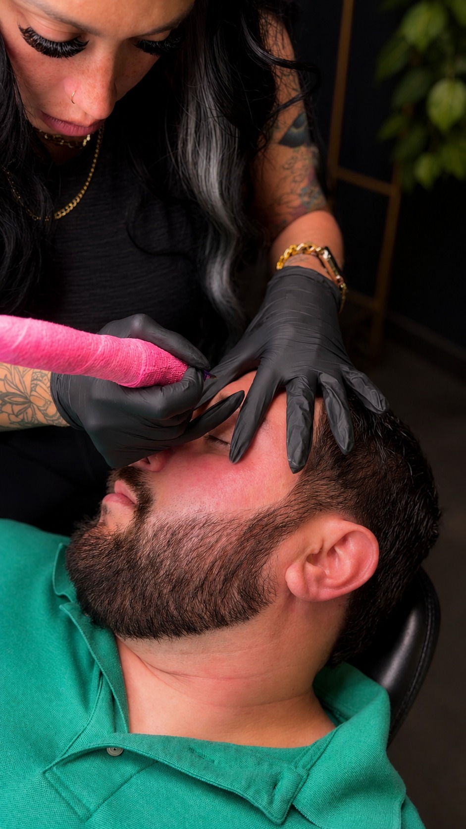 Chare'e Marniece working on a male brow client at The Brow Babes Louisville